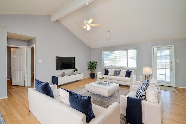 living room featuring beamed ceiling, ceiling fan, high vaulted ceiling, and light hardwood / wood-style flooring