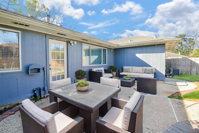 view of patio with central AC unit and outdoor lounge area