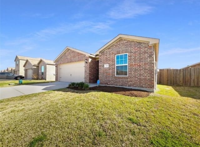 view of front facade with a garage and a front lawn