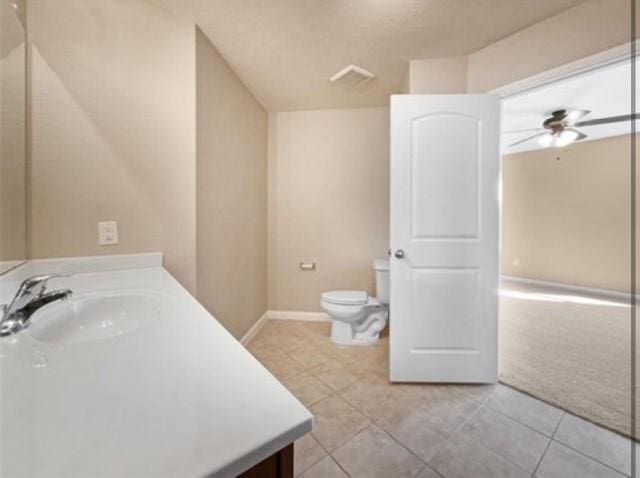 bathroom with ceiling fan, vanity, and tile patterned flooring