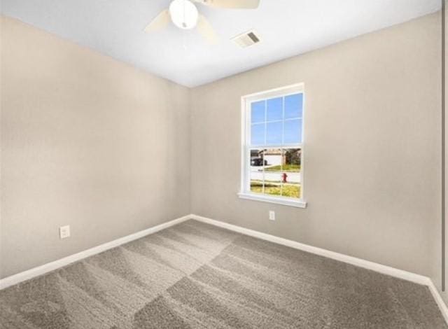 unfurnished room with ceiling fan and carpet flooring