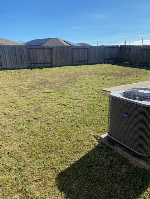 view of yard featuring central air condition unit