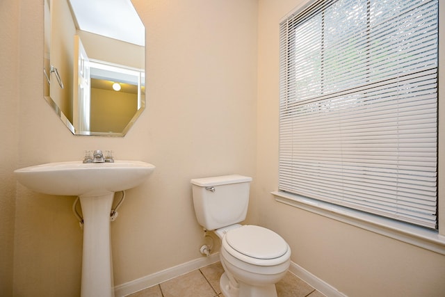 bathroom featuring tile patterned flooring and toilet