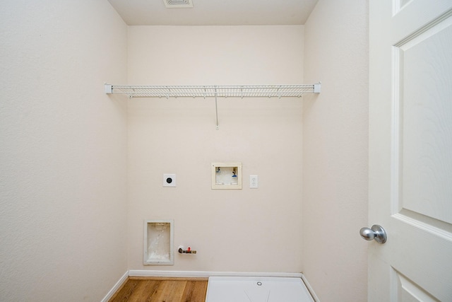 laundry room with electric dryer hookup, washer hookup, hookup for a gas dryer, and hardwood / wood-style floors