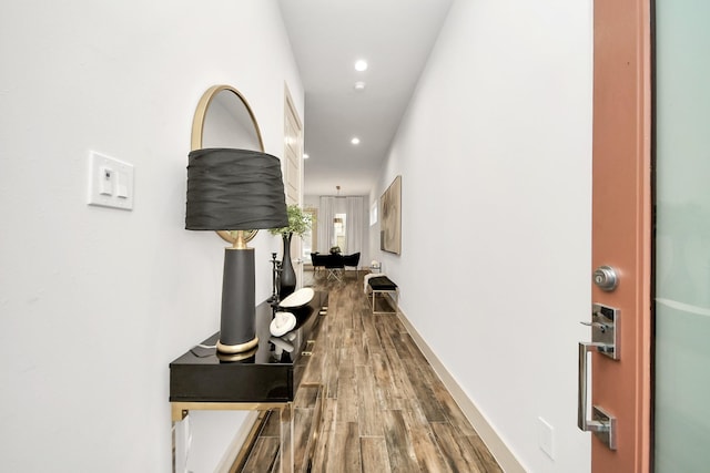 hallway with wood-type flooring