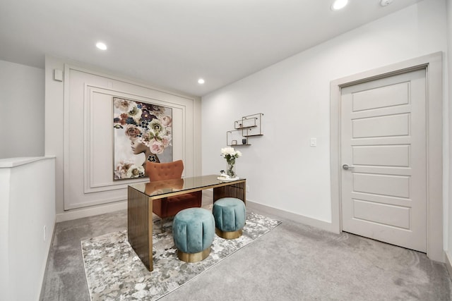 office area with recessed lighting, light colored carpet, and baseboards