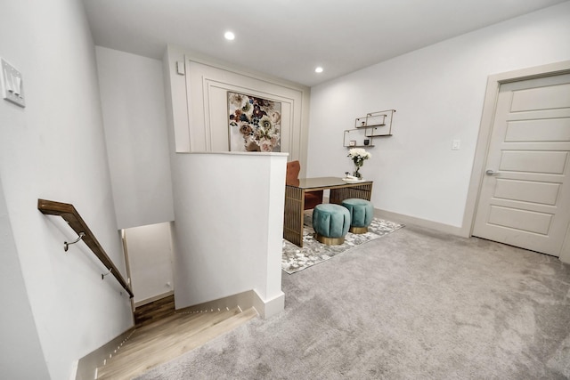 interior space featuring recessed lighting, baseboards, an upstairs landing, and carpet flooring