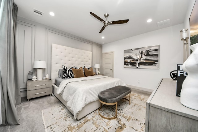 bedroom featuring light colored carpet and ceiling fan