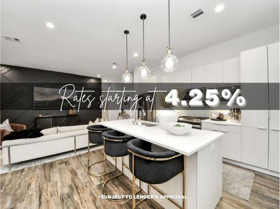 kitchen featuring light countertops, open floor plan, white cabinets, a sink, and an island with sink