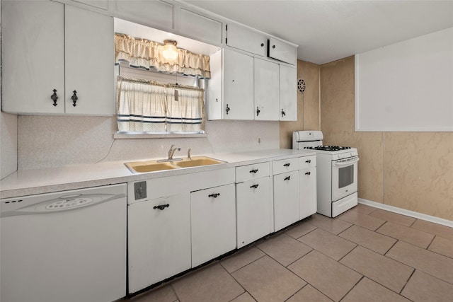 kitchen with white cabinetry, sink, white appliances, and light tile patterned flooring