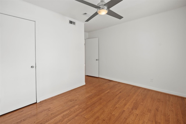 unfurnished bedroom with ceiling fan and light hardwood / wood-style floors