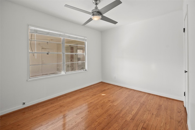 spare room featuring ceiling fan and light wood-type flooring