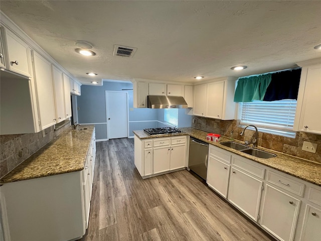 kitchen featuring light stone countertops, appliances with stainless steel finishes, sink, and white cabinets