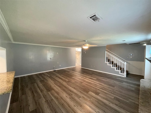 unfurnished living room featuring ornamental molding, dark hardwood / wood-style floors, a textured ceiling, and ceiling fan