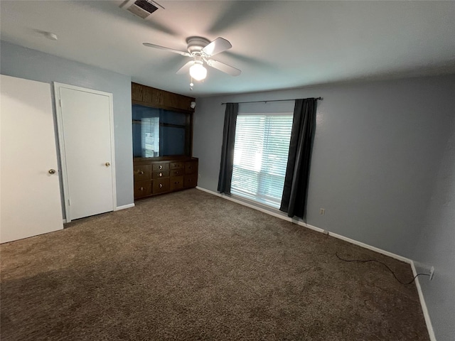 unfurnished bedroom featuring carpet flooring and ceiling fan