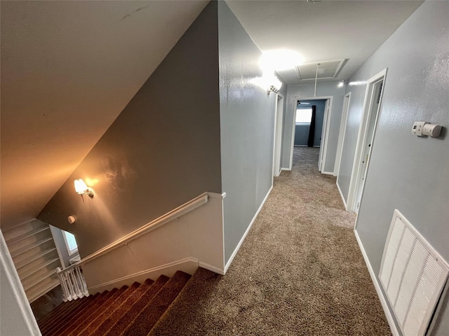 hallway with light colored carpet