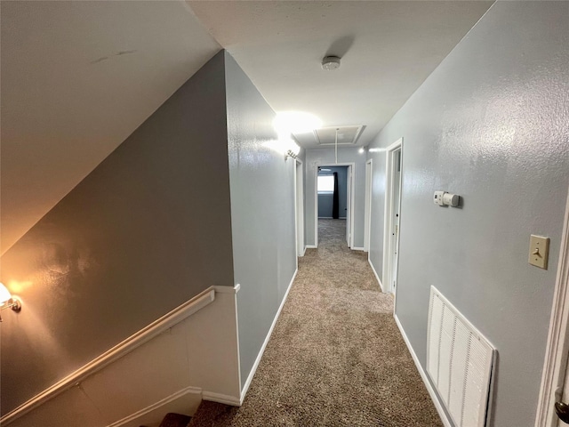 corridor with light colored carpet