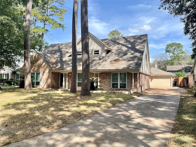 view of front facade with a garage and a front yard