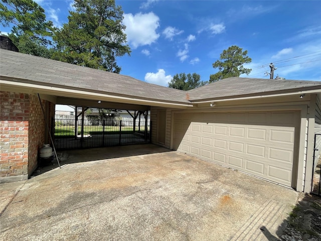 exterior space with a carport and a garage