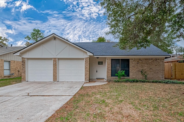 ranch-style house with a garage and a front lawn