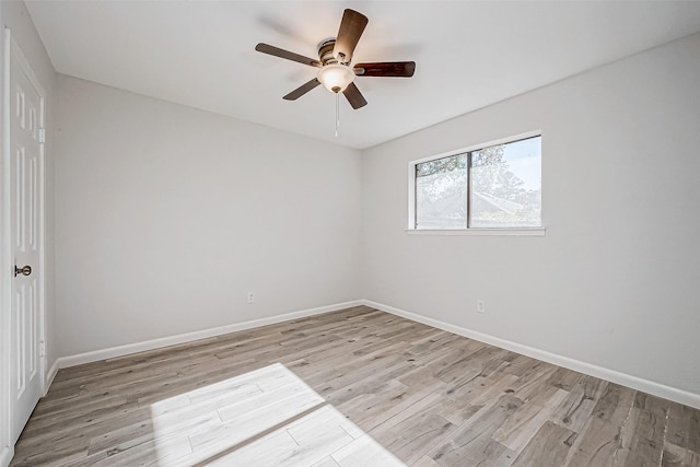 unfurnished room with ceiling fan and light wood-type flooring