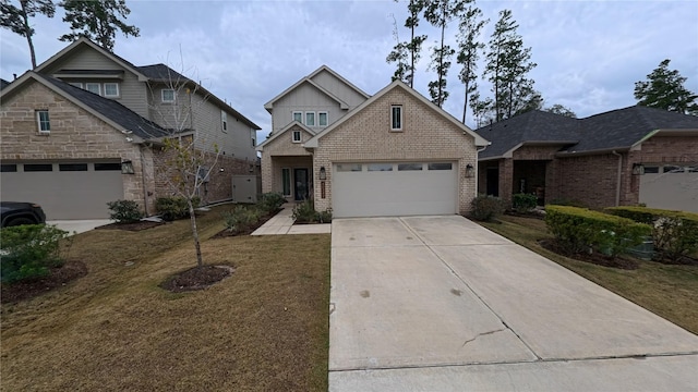 view of front of home featuring a garage and a front yard