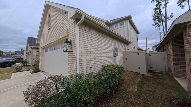 view of property exterior with a garage