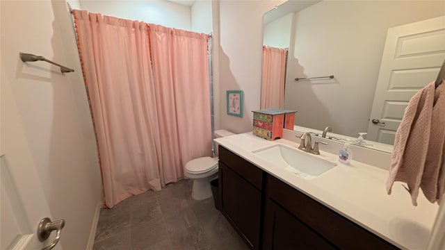 bathroom featuring vanity and toilet