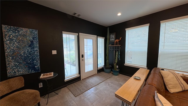 entryway with light tile patterned floors