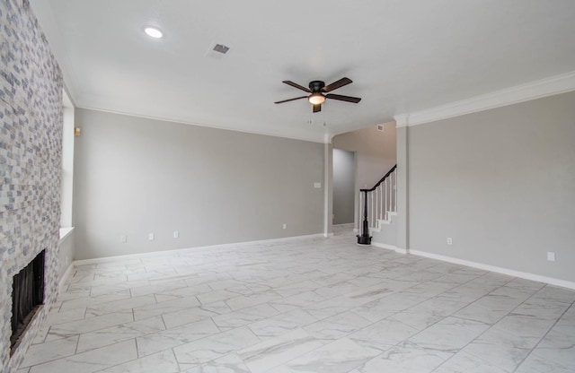 unfurnished living room featuring a fireplace, visible vents, stairs, marble finish floor, and crown molding