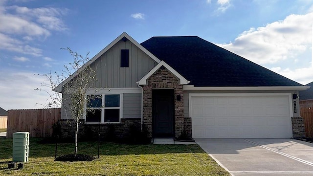 view of front of house with a garage and a front yard