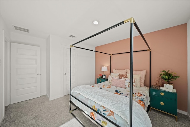 carpeted bedroom with a closet