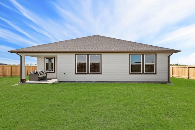 back of property with a patio, outdoor lounge area, and a yard