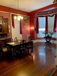 dining space featuring dark hardwood / wood-style floors