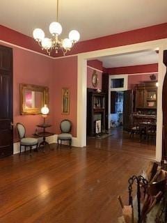 interior space with wood-type flooring and a chandelier