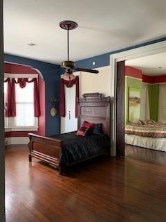 bedroom with hardwood / wood-style flooring