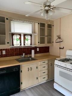 kitchen with sink, dishwasher, backsplash, dark hardwood / wood-style floors, and white range with gas cooktop