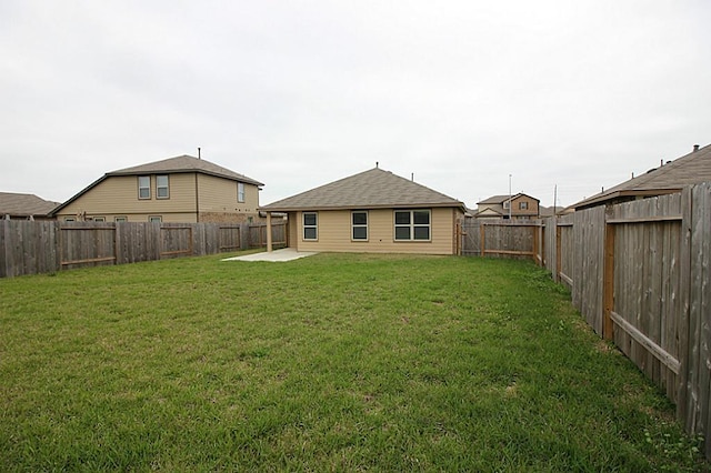 view of yard featuring a patio and a fenced backyard