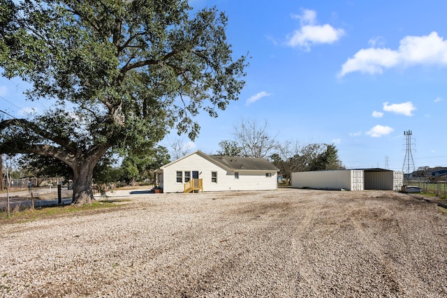 ranch-style house with an outbuilding