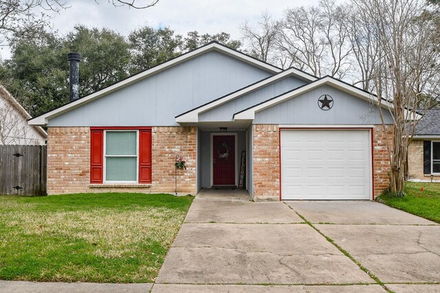 view of front of property with a garage and a front lawn