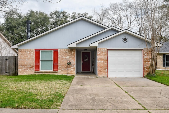 view of front of property featuring a garage and a front lawn