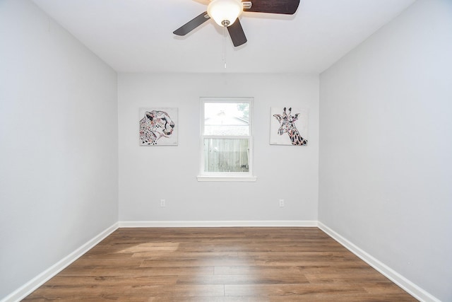 empty room featuring ceiling fan and hardwood / wood-style floors