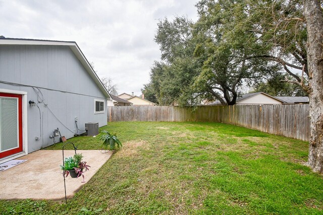 view of yard with a patio area and central air condition unit