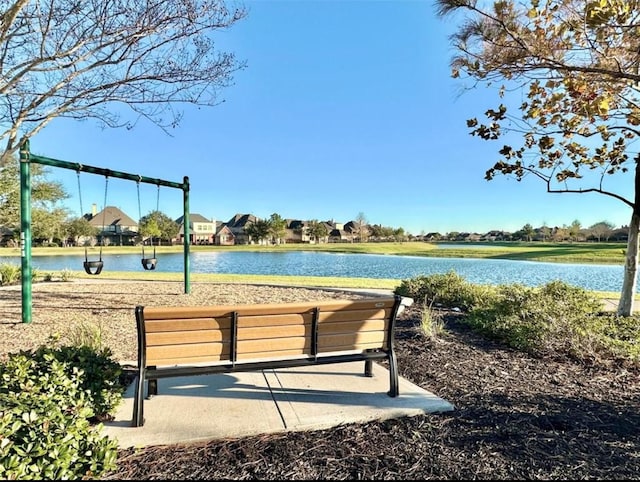 view of community with a water view