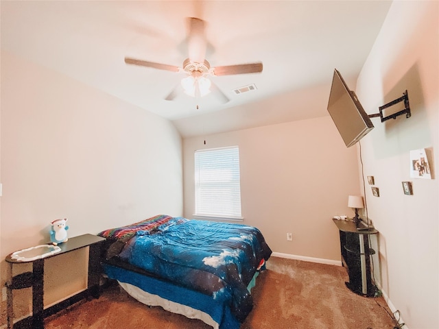 carpeted bedroom featuring visible vents, baseboards, lofted ceiling, and ceiling fan