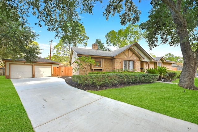 view of front of home with a garage and a front yard