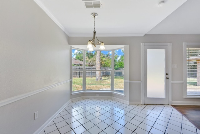 unfurnished dining area featuring a notable chandelier, light tile patterned floors, and ornamental molding