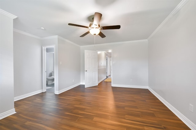 spare room featuring dark hardwood / wood-style flooring, crown molding, and ceiling fan