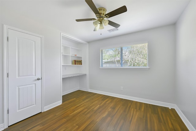 spare room featuring dark hardwood / wood-style floors and ceiling fan