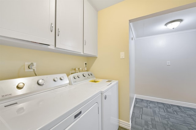 clothes washing area featuring cabinets, carpet, and washing machine and clothes dryer